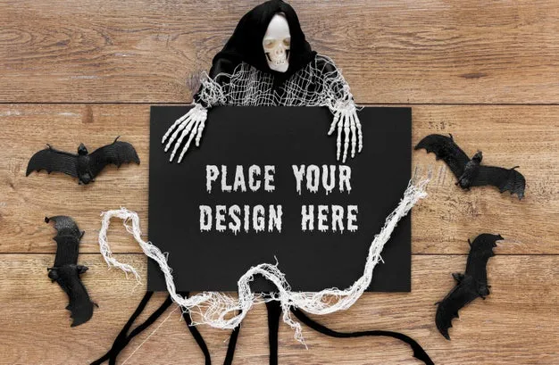 Free Bats And Skeleton On Wooden Table Psd